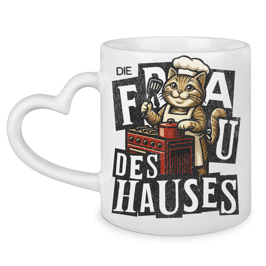 Tasse mit Herzhenkel Die Frau des Hauses - Katze am Kochen